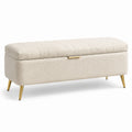 Banco de almacenamiento de tela bouclé beige con patas de metal dorado